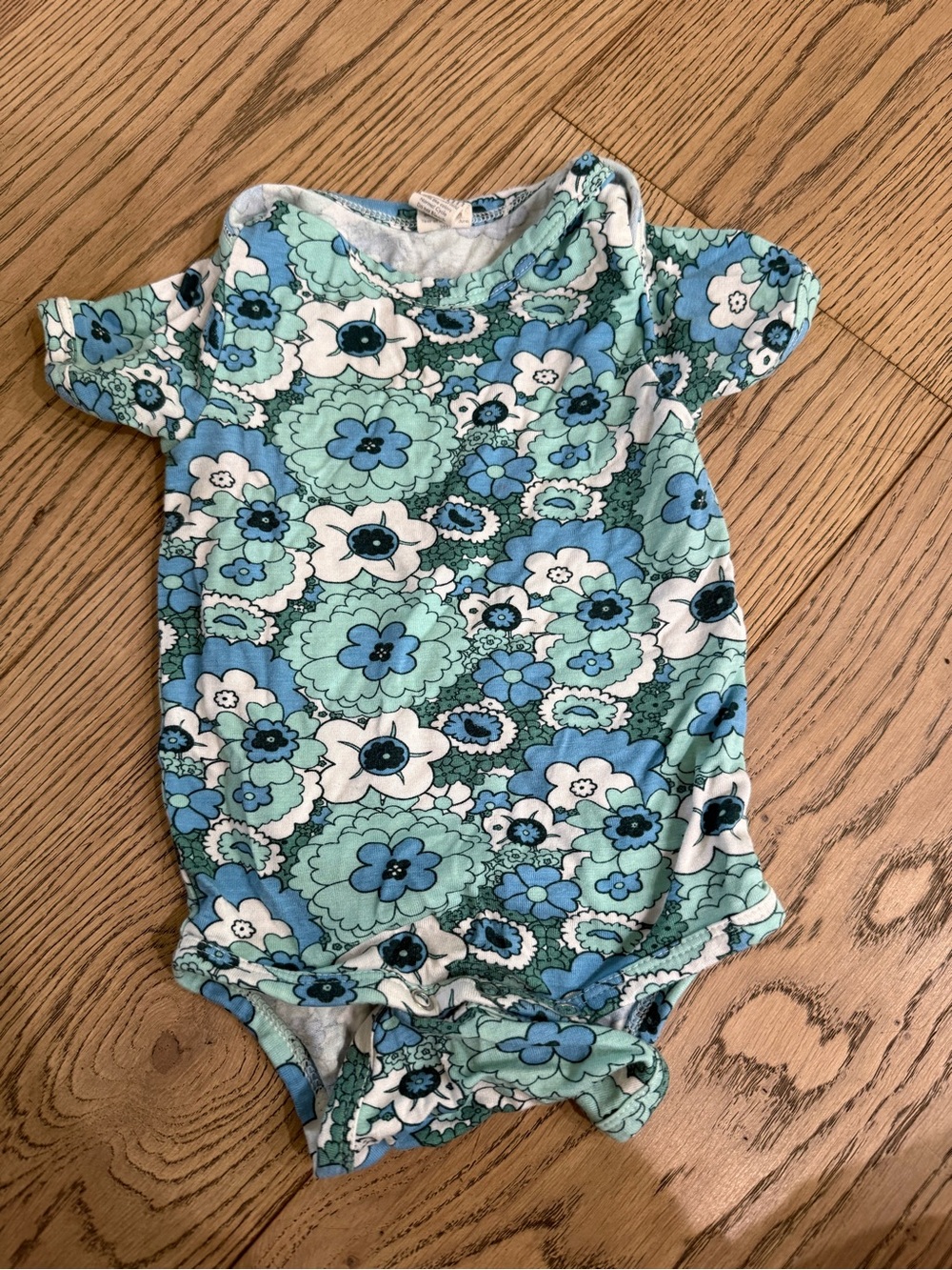 kate quinn Floral Baby Onesie in Aqua, Light Blue, and White